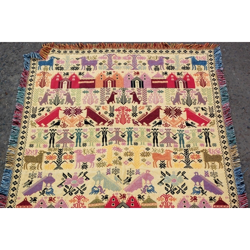 37 - An unusual reversible flatweave rug decorated with animals and people etc