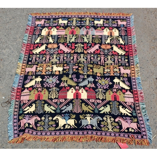 37 - An unusual reversible flatweave rug decorated with animals and people etc