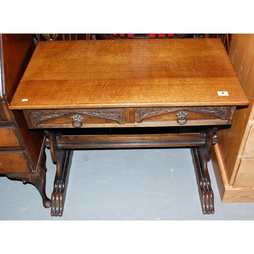 4 - A carved oak side table with drawers