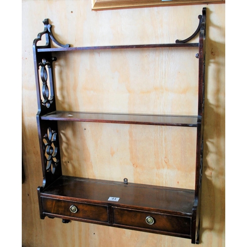 44 - An antique fretwork wall shelf with drawers