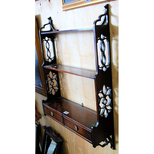 44 - An antique fretwork wall shelf with drawers