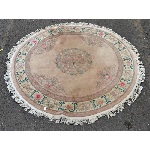 109 - A large circular Chinese rug - Postage/packing not available.