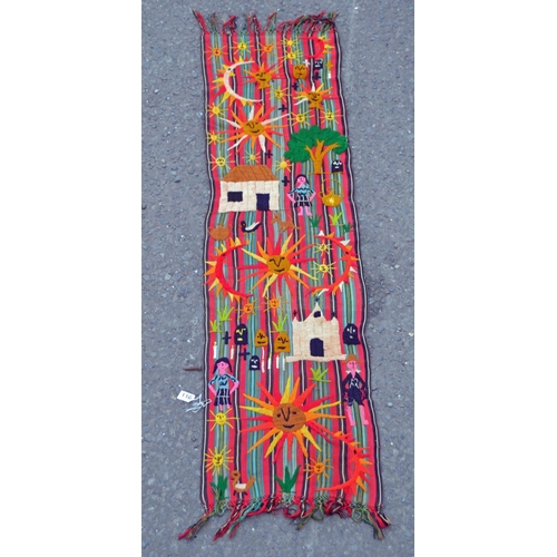 116 - An unusual embroidered rug