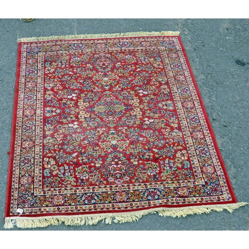 118 - A large red ground rug with Herati border - Postage/packing not available.