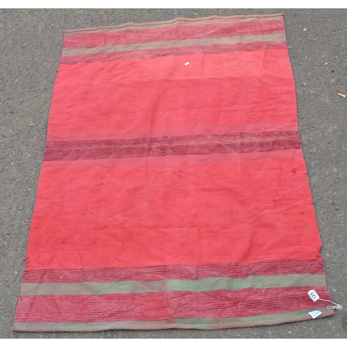 125 - Thin red ground rug