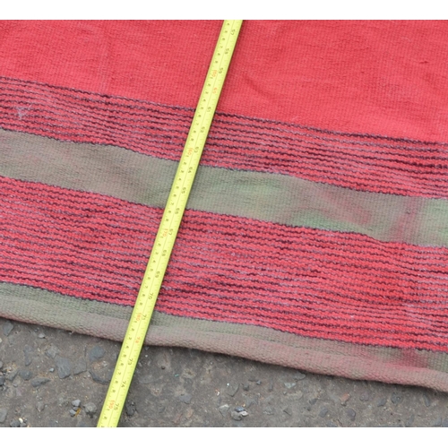 125 - Thin red ground rug