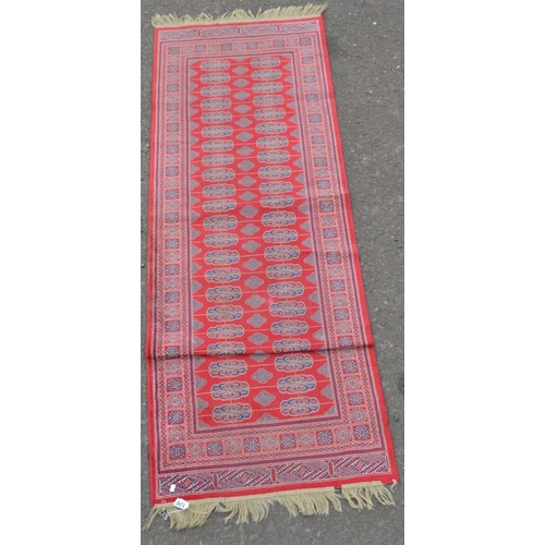 126 - Red ground runner rug