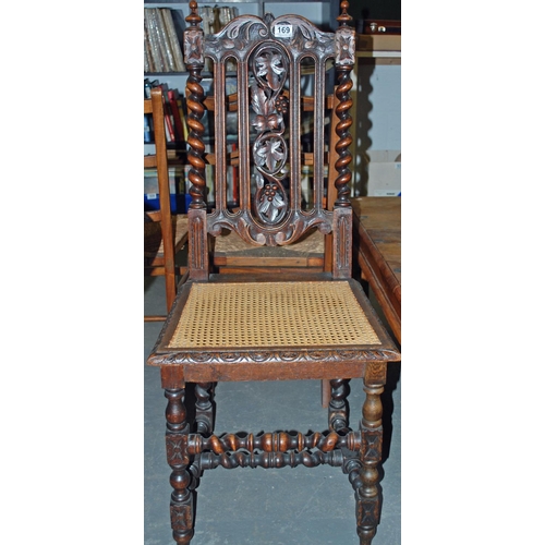 169 - Antique Jacobean style carved oak hall chair - Postage/packing not available.