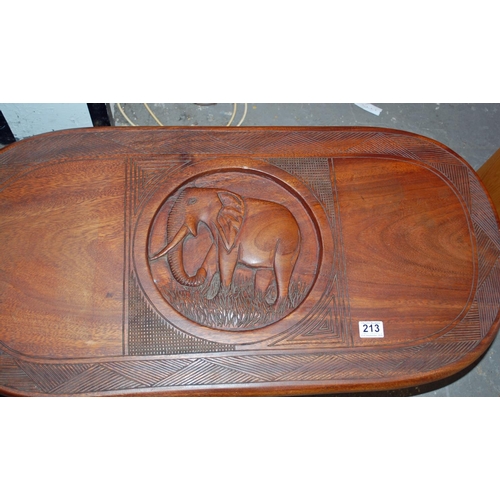 213 - Carved African hardwood table - Postage/packing not available.