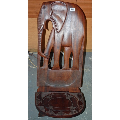 214 - A carved African hardwood birthing chair - Postage/packing not available.