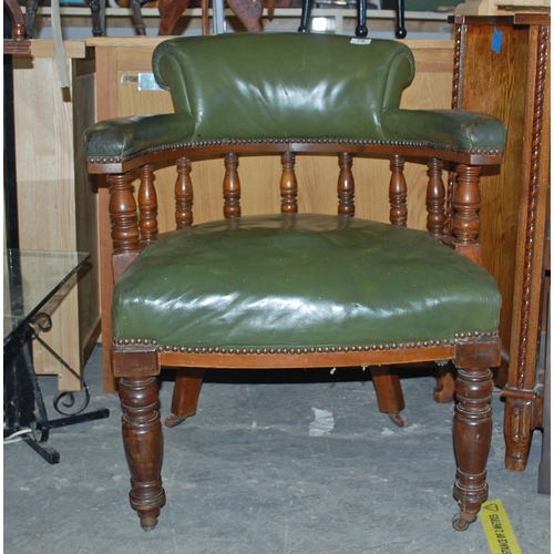 76 - A green leather seated captains chair - Postage/packing not available.