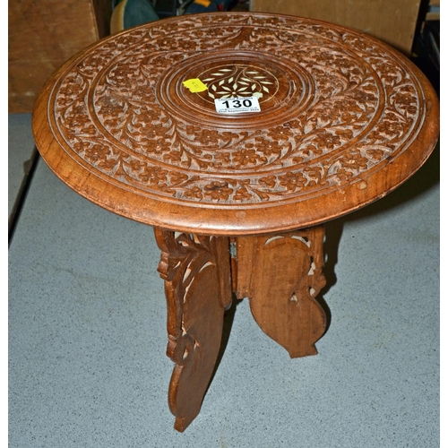 130 - Carved folding table - Postage/packing not available.