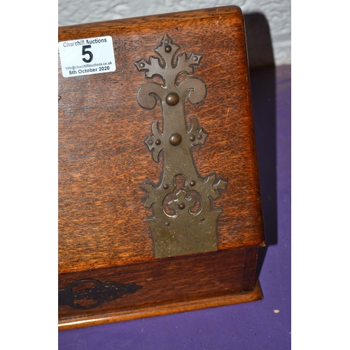 5 - An antique Oak Gothic Revival style desk top stationary box with brass straps