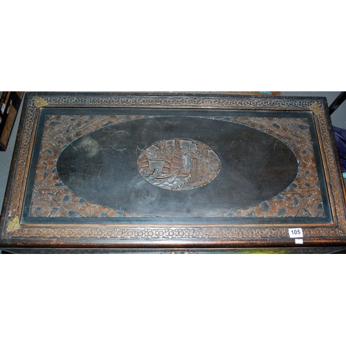 105 - A vintage Oriental camphorwood chest with carved details - Postage/packing not available.