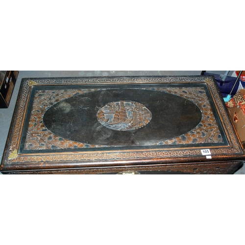 105 - A vintage Oriental camphorwood chest with carved details - Postage/packing not available.