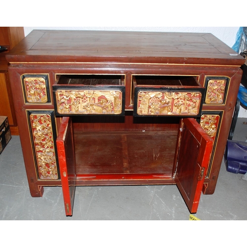 106 - A vintage Oriental cabinet with lacquered and gilt carved panels - Likely early 20th century - Posta... 