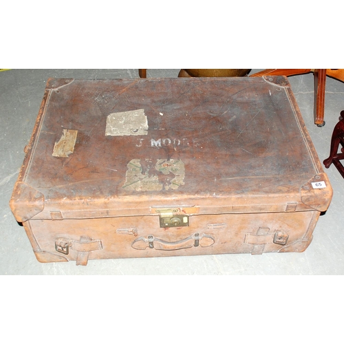 65 - Vintage leather travelling trunk with labels - Postage/packing not available.