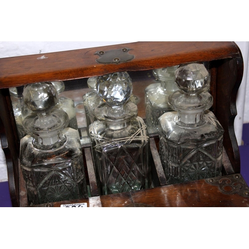 330 - An antique oak cased 3 bottle tantalus - Postage/packing not available