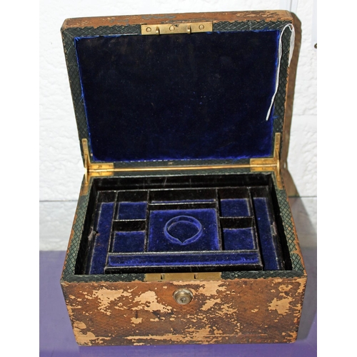 343 - An antique leather jewellery box with Bramah lock - Postage/packing not available