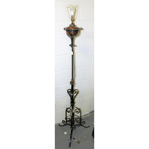 312 - An antique copper and wrought iron lamp later converted to electricity - Postage/packing not availab... 