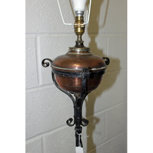 312 - An antique copper and wrought iron lamp later converted to electricity - Postage/packing not availab... 