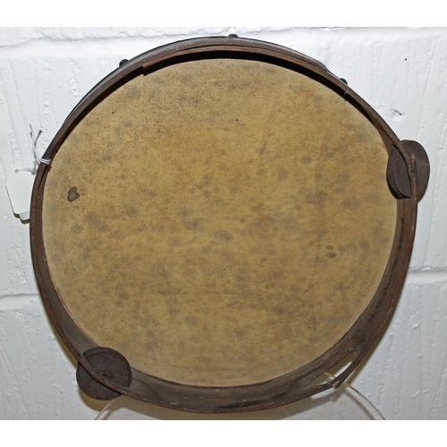 671 - A 19th century tambourine with hand painted picture