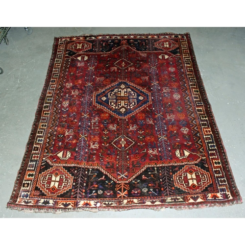 255 - A large Iranian handmade Kashgai rug with red and blue ground - Postage/ Packing not available