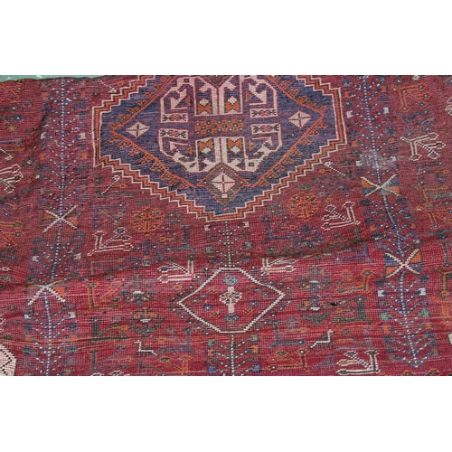 255 - A large Iranian handmade Kashgai rug with red and blue ground - Postage/ Packing not available