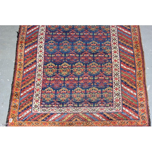 258 - A vintage long wide multi-coloured runner rug believed to be handmade