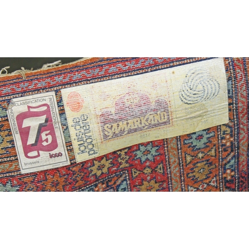 260 - A large multi-coloured Samarkand runner rug