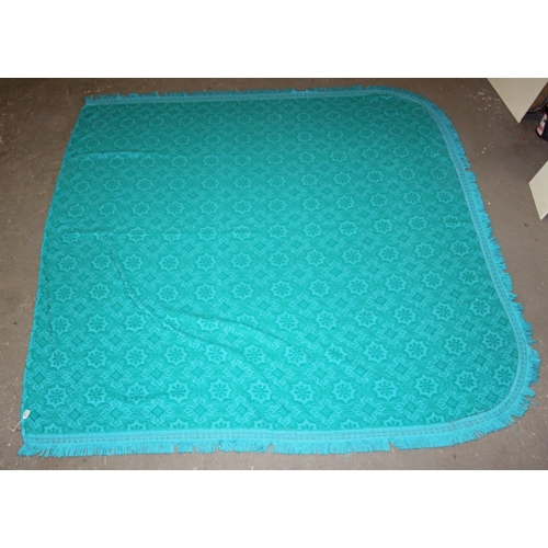 263 - A large vintage turquoise reversible bed throw