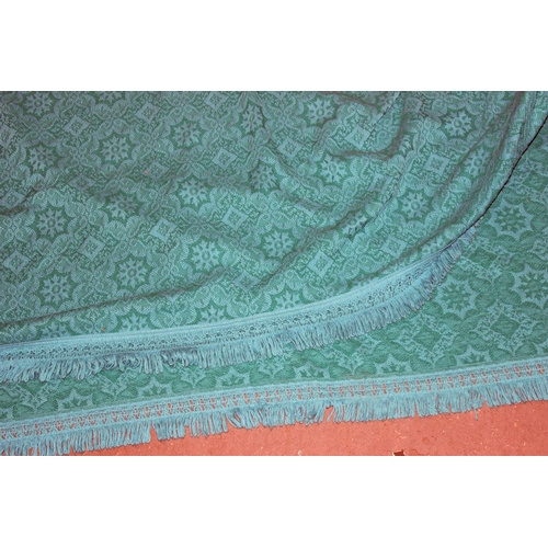 263 - A large vintage turquoise reversible bed throw