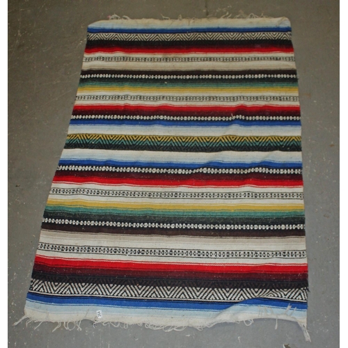 264 - A multi-coloured flat weave rug