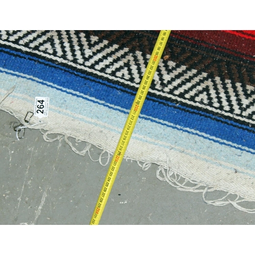 264 - A multi-coloured flat weave rug