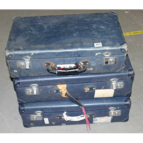 353 - A stack of 3 vintage blue suitcases - Postage/packing not available