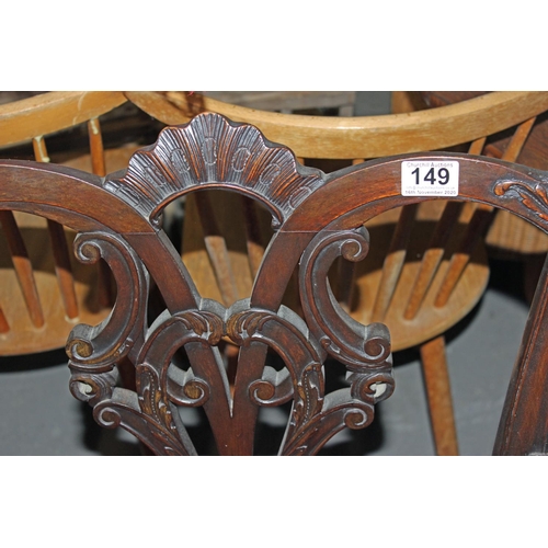 149 - An Antique carver arm chair with quality carving and 