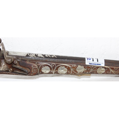 1011 - A flintlock pistol with extensive silver inlay - believed to be French c. early 19th century