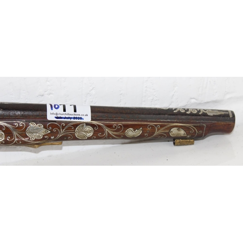 1011 - A flintlock pistol with extensive silver inlay - believed to be French c. early 19th century