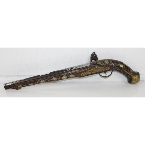 1011 - A flintlock pistol with extensive silver inlay - believed to be French c. early 19th century