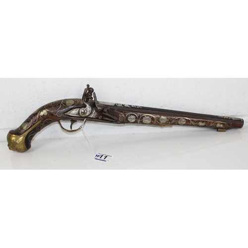 1011 - A flintlock pistol with extensive silver inlay - believed to be French c. early 19th century