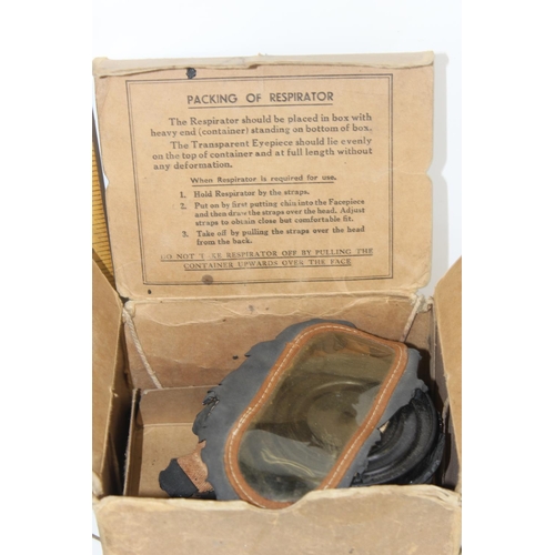 1021 - 1945 dated military field telephone and a gas mask in box