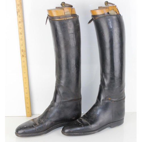 1030 - A pair of leather riding boots and trees by Bunting of London - likely military