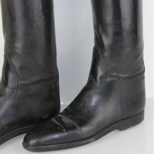 1030 - A pair of leather riding boots and trees by Bunting of London - likely military