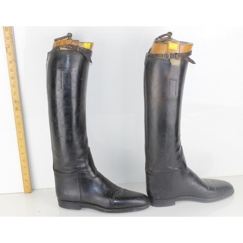 1030 - A pair of leather riding boots and trees by Bunting of London - likely military