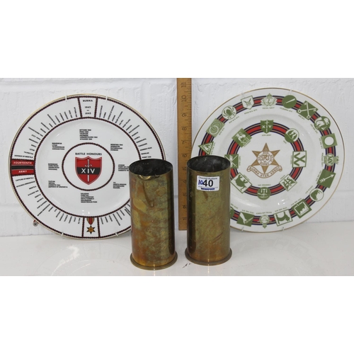 1040 - A pair of brass shell cases and 2 military plates by Coalport