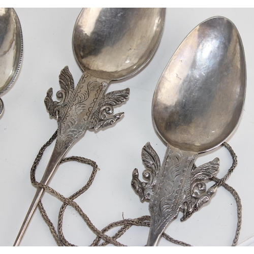 1122 - Qty of large white metal spoons in the manner of Roman spoons with decorated bowls and a similar sty... 