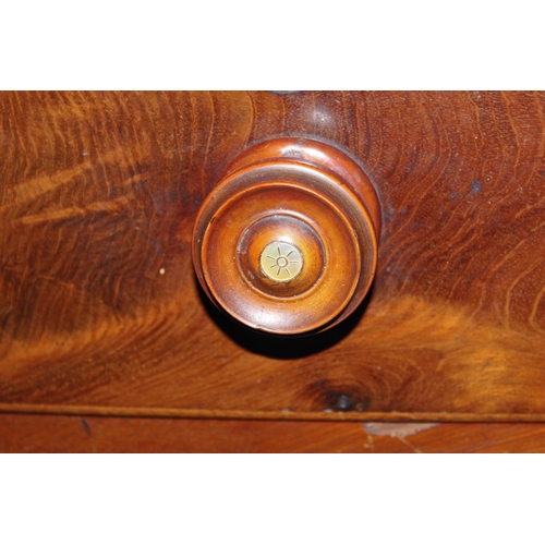 113 - A Victorian Mahogany veneered chest of drawers with turned wooden handles set with Mother of Pearl