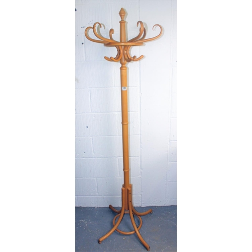 121 - A light wood free standing coat & hat stand