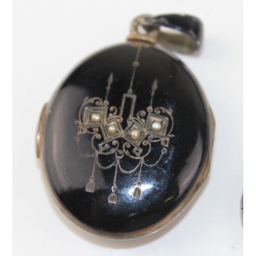 1265 - 2 antique pendants - one a black enamel and seed pearl set locket bearing indecipherable marks and t... 