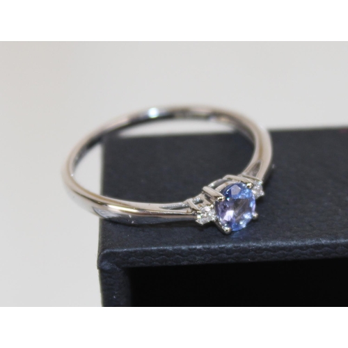 1270 - A 9ct white gold, diamond and Tanzanite ring in box - size R 1/2